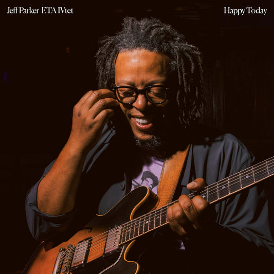 Jeff Parker playing guitar with a dark background - Jeff Parker ETA IVtet - Happy Today album cover