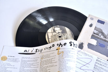 Johnny Coley - As I Slip Into The Sky, LP center label and open booklet, close-up. Lobby Art Editions, USA, 2026, LP. Available at Seasonal Work Records.