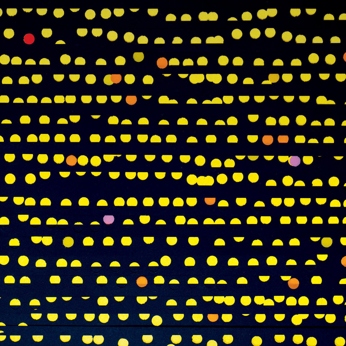 Pattern of yellow dots on a black background