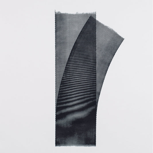 Black and gray striped fabric on a light gray background